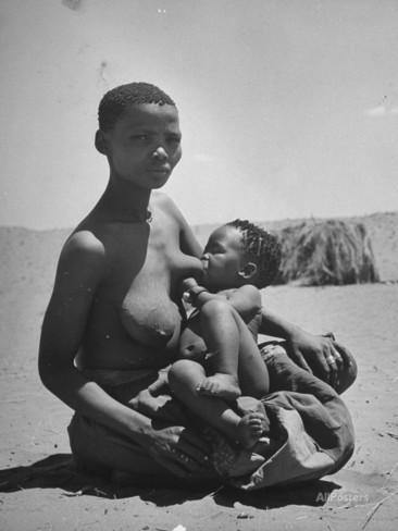 a-bushman-woman-breast-feeding-her-baby